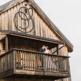 bride and groom on balcony