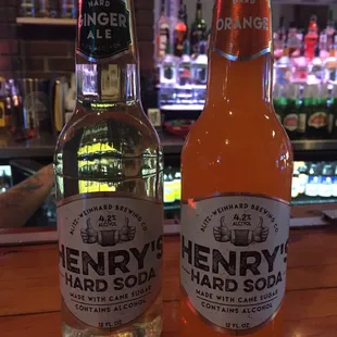 two bottles of henry's hard soda
