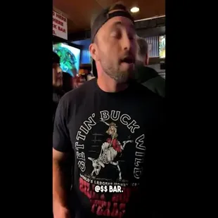 a man in a black t - shirt