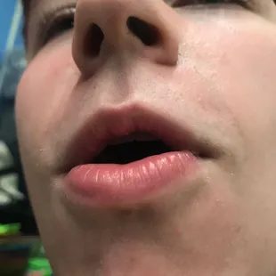 a close up of a boy's mouth