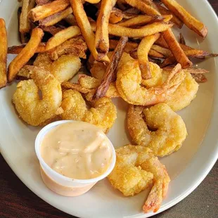 Bang Bang Shrimp Basket with Handcut Fries and sauce on the side.