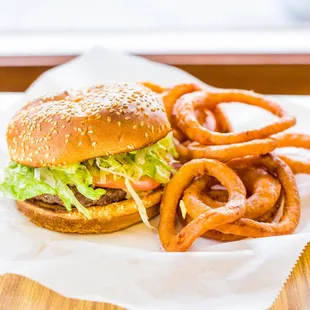 a hamburger and onion rings