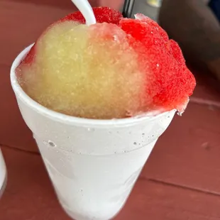a cup of ice cream with a straw