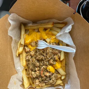 Cheese Fries with crawfish and crabmeat.