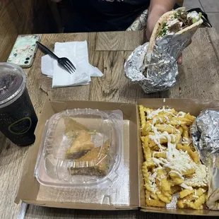 Top #1 Traditional Gyro Bottom #3 Beef Pita with requested no vegetables, side of Greek fries, Dr. Pepper, Baklava pastry dish.