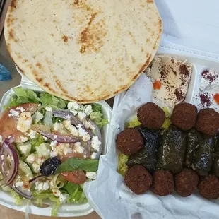 Veggie Plate. Salad, 1 pita, hummus, tahini sauce, rice, grape leaves, falafel
