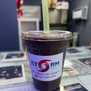 a drink in a plastic cup with a straw