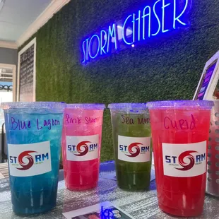 a row of cold drinks on a table