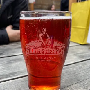 a glass of beer on a table