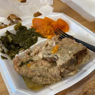 Smothered pork, greens, cornbread, yams