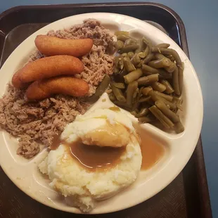 Pulled pork, mashed potatoes, green beans, hush puppies