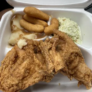 Two breast combo with slaw, mashed, and hush puppies