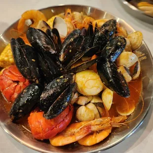 AYCE with lobster (1st order only), mussel shells , boiled eggs, clams, corn, head on shrimps with combination sauce