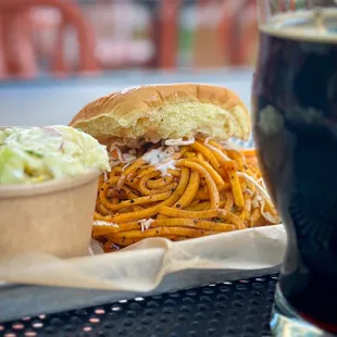 a plate of food and a glass of beer