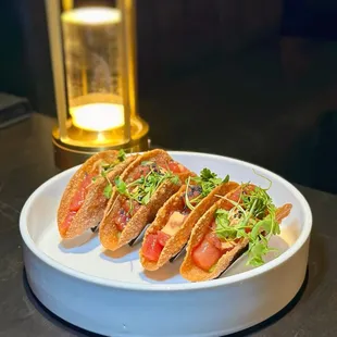 AHI TUNA TACOS - Mini wonton taco shells filled w/ chopped Ahi Tuna, ginger soy vinaigrette, avocado mousse, gochujang aioli - Outstanding