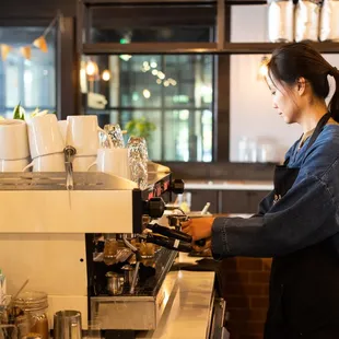 a bari serving a cup of coffee