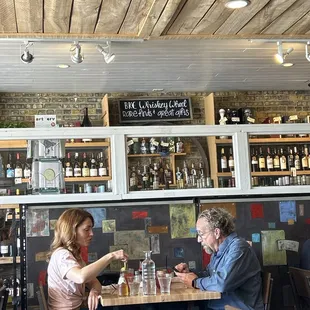 a man and a woman sitting at a table