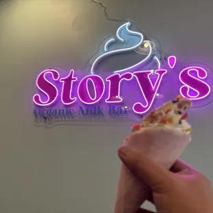 Durian soft serve, in the orange creamsicle cone!