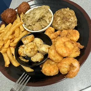 Scallops , shrimp , French fries , crab cake ( salty ) cabbage &amp; hush puppies