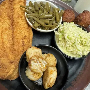 Fried catfish , scallops , coleslaw , green beans &amp; hush puppies