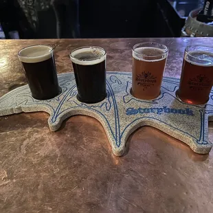 a flight of beers on a table