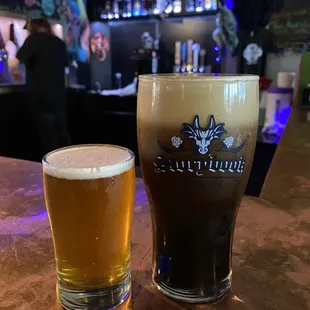 a glass of beer and a pint of beer