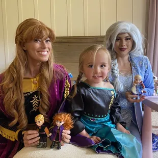 Anna and Elsa doing a tea party with the birthday girl.