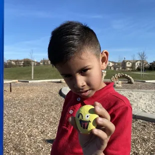 He found a cute rock in the sand box!! Great little park.