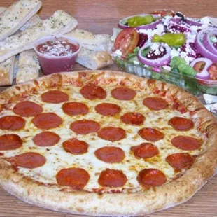 a pepperoni pizza and a salad