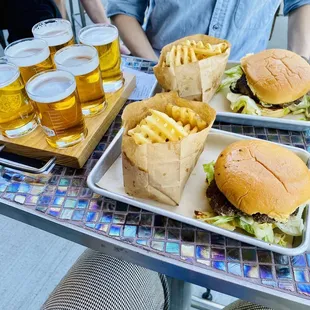 Waffle fries, burgers and a flight of beers