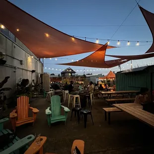 a patio with tables and chairs