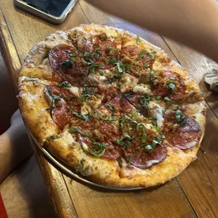 a pizza with pepperoni and cheese