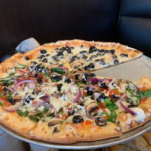 Veggie pizza olives on half.......