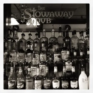 a shelf of liquor bottles