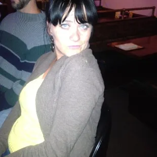 a woman sitting at a bar