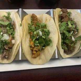 L to R: carnitas, al pastor, carne asada