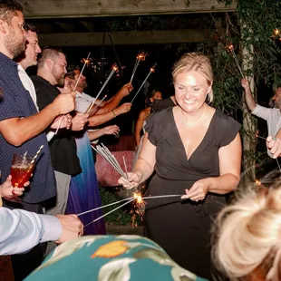 Kim helping get sparklers lit