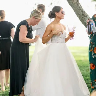 Kim bustling my dress.