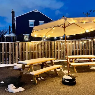 a picnic table with an umbrella