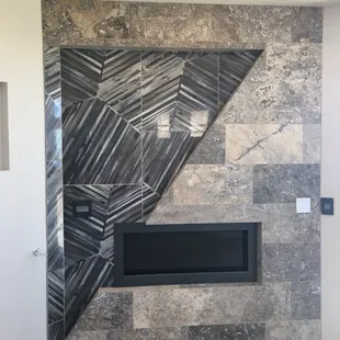 Fireplace Wall w/ Silver Travertine &amp; Porcelain Accent Tile.