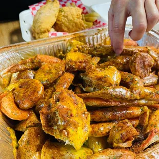 a tray of shrimp and crab legs