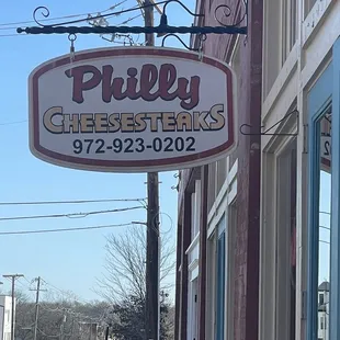 a sign for a cheese shop