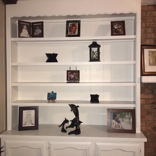 This is the built in book shelf they painted for me. It used to be a grape leaf green and they painted it so well no one would ever notice.