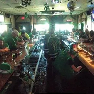a group of people sitting at a bar