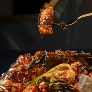 Whole Fish-
Crispy whole fish with tail, head, eyes and all. Baby Bok Choy, Thai Basil, Chili Garlic Sauce