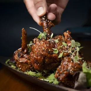 Crispy Chicken "Lollipops"-
Frenched Chicken Drumettes, Palm Sugar Chili-Sambal Glaze with Sesame Seed