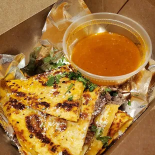 Piping hot and extremely delicious birria quesadillas, great with or without the sauce!