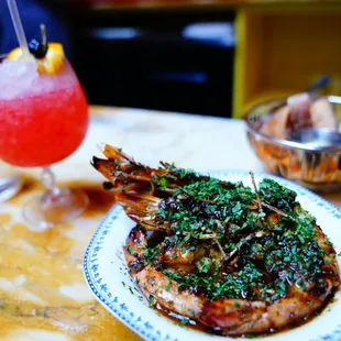 Barbeque shrimp. Gigantic, saucy, would be the star of any other meal.  Sauce made for great dipping for bread and other items.