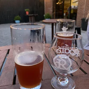 two glasses of beer on a table