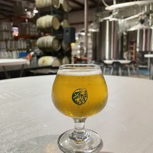 a glass of beer on a table